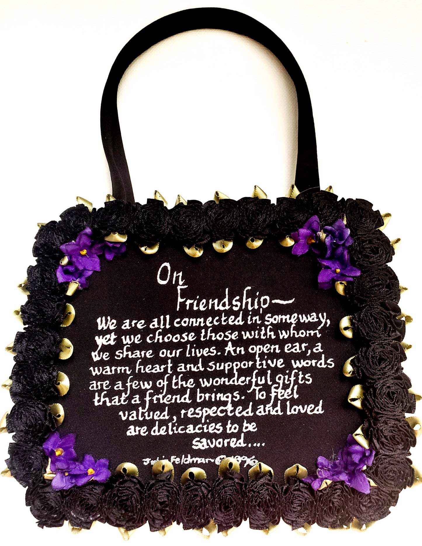 black satin evening bag with On Friendship written message with black silk carnation around the border and delicate corner flower accents