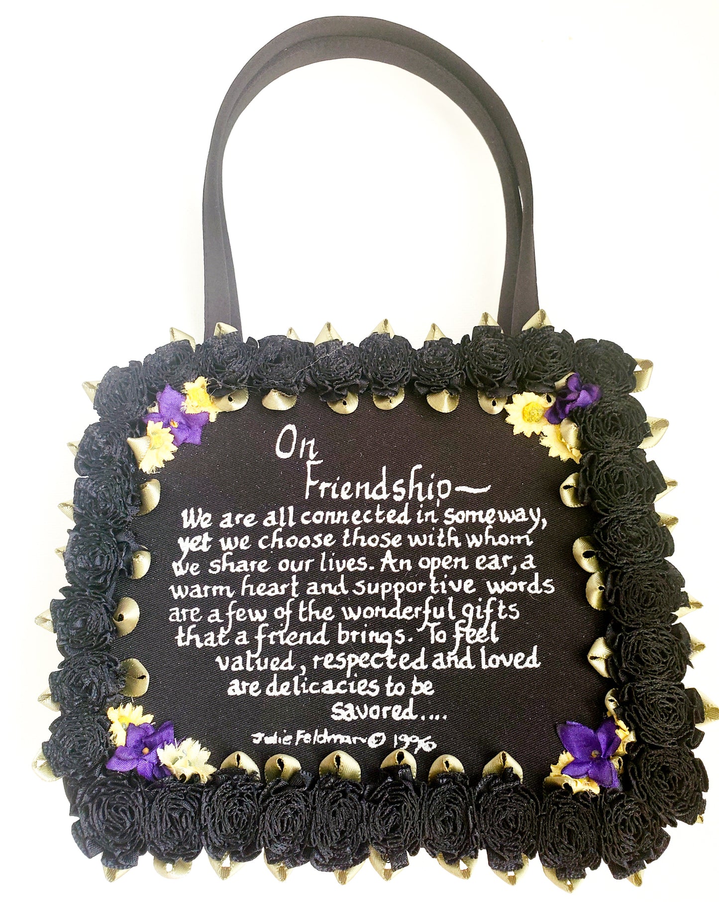 black satin evening bag with On Friendship written message with black silk carnation around the border and delicate corner flower accents
